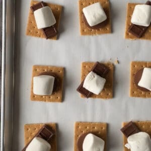 marshmallow long side down on top of candy for smore candy cookie