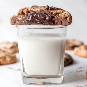 copycat Godiva ganache filled cookie sitting on top of a glass of milk