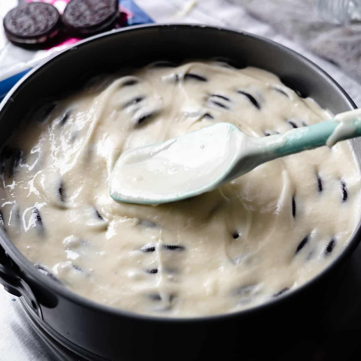 Top the cookies with the remaining cake batter.